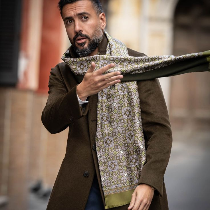 Warmth meets refinement: Experience the essence of Italian craftsmanship in every thread.Whether you wear it with your favorite suit or dress it down with jeans and a sweater, this versatile scarf is sure to become a go-to in your cold weather wardrobe. This elegant scarf has two sides: One side is silk twill with a classic yet modern print in shades of olive and tan. The other side is a lightweight, finely woven wool in the darkest olive green. Details Sized for a perfect drape: Approx. 12.5” x Formal Pashmina Shawl For Fall, Classic Silk Scarf For Winter Formal, Classic Winter Silk Scarf For Formal Occasions, Classic Business Scarves For Fall, Classic Formal Silk Scarf For Winter, Luxury Winter Scarves, Classic Fall Business Scarves, Elegant Silk Shawl For Winter, Luxury Winter Formal Scarves