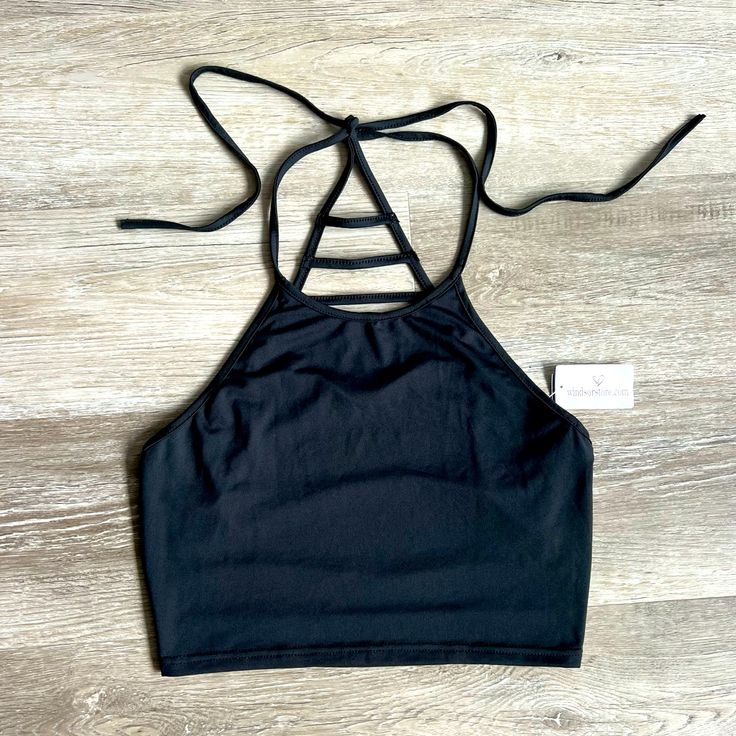 Brand New With Tags And Unworn Crop Top By Windsor. High, Halter Neck. Strappy Open Back. 95% Polyester, 5% Spandex. Black Crop Top Tank Top For Beach, Sporty Black Crop Top For Summer, Sporty Black Crop Top For Beach, Casual Black Stretch Halter Top, Fitted Sporty Black Halter Top, Sporty Fitted Black Halter Top, Black Stretch Crop Top For The Beach, Stretch Black Crop Top For The Beach, Black Halter Neck Tank Top For Sports