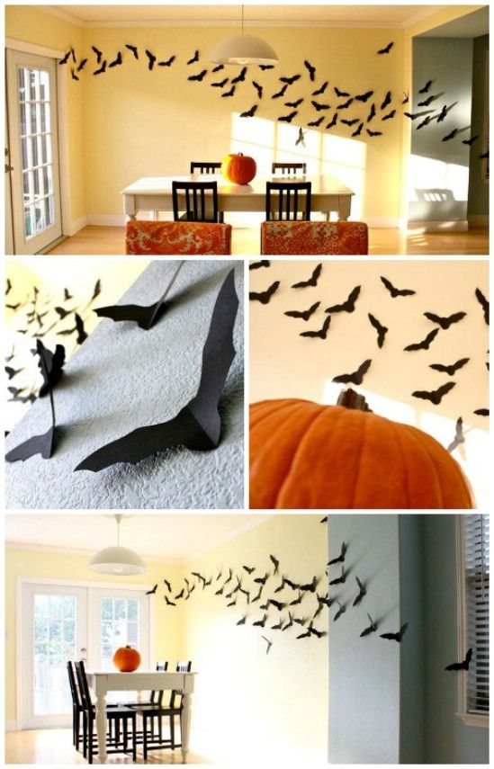 halloween decorations in the living room and dining room with bats on the wall, bat cutouts