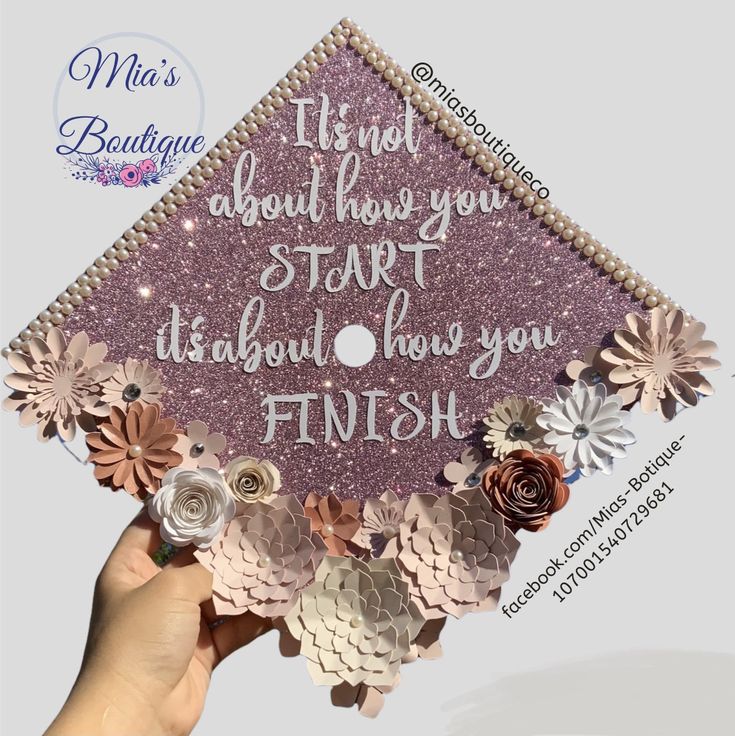 someone is holding up a purple graduation cap with flowers and words on the side that says, it's not about having you start it all through how you finish