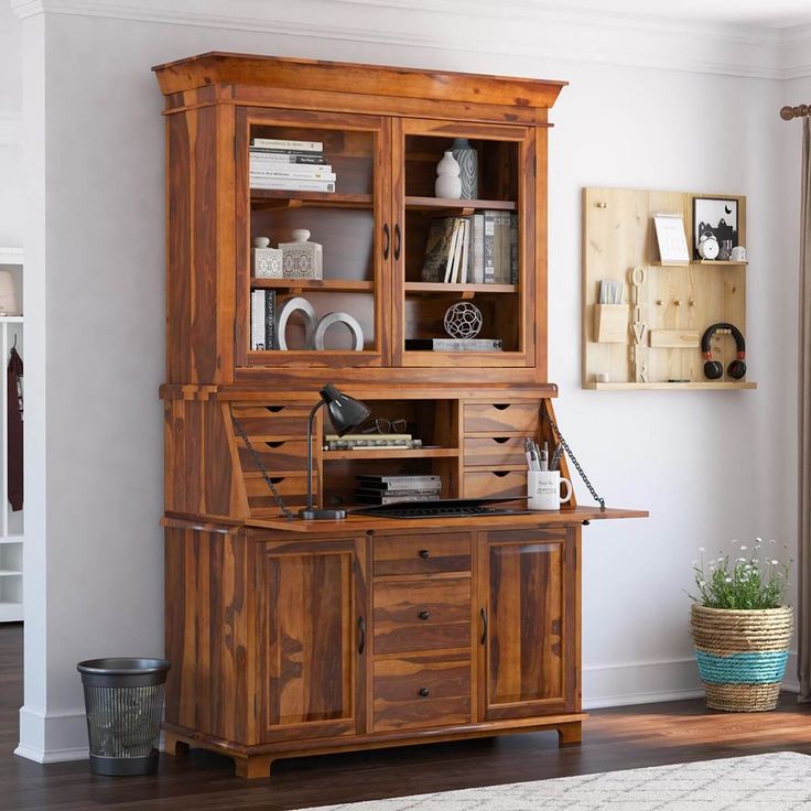 a wooden hutch sitting on top of a hard wood floor