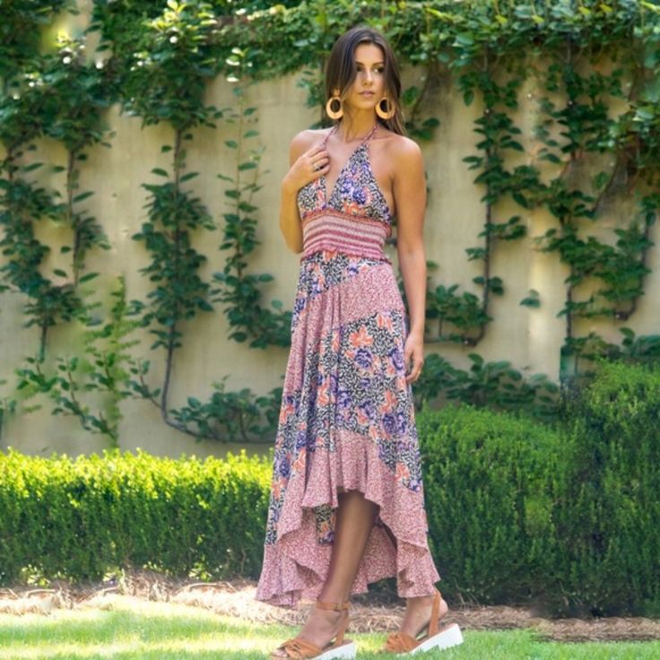 A Gorgeous Boho Sundress, Very Flattering To Wear. Flowy Mixed Floral Print Sharkbite Hem Dress. Halter Neck With Self-Tie Strips Plunging V-Neck - Sleeveless - Smocked Ruffled Waist The Size Can Fit S-M Due To The Small Elastic Waist And Wide (High-Low) Flirty Skirt The Jacket Is Mine But To Give You An Idea Of What You Can Do With This Lovely Dress. The Dress Shines With High Positive Energy Waiting To Shine In Its New Home The Fabric Is Breathy, Flowy, And Soft 100% High-Quality Rayon Healthy Pink Halter Maxi Dress For Summer, Pink Halter Dress For Spring Vacation, Pink Summer Halter Dress For A Day Out, Pink Halter Neck Midi Dress For Day Out, Bohemian Fitted Sundress For Brunch, Fitted Bohemian Sundress For Brunch, Pink Halter Sundress For Brunch, Pink Floral Print Halter Maxi Dress, Pink Floral Print Maxi Halter Dress