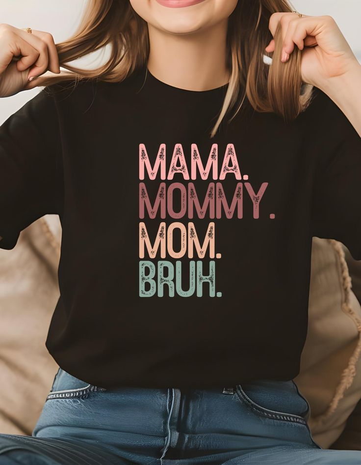 Celebrate the unique bond between mothers and their sons with this playful and heartwarming t-shirt. This tee is a perfect way to express your love and appreciation for your son. Made from soft, high-quality materials, it's both comfortable and stylish. Whether you're spending quality time together or simply want to show your support, this t-shirt is a must-have for any proud mom. - 100% premium cotton (Blackberry and Neon Blue are 50% cotton, 50% polyester) Mother's Day Crew Neck T-shirt, Black T-shirt With Funny Text For Mother's Day, Cute Black T-shirt For Mother's Day, Cute Family T-shirt With Letter Print, Family Funny Print Graphic Tee, Funny Black T-shirt For Mother's Day, Mother's Day Family Matching Crew Neck T-shirt, Mother's Day Black T-shirt With Funny Print, Black T-shirt With Name Print For Parenting