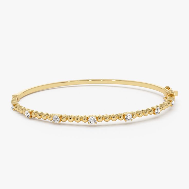 Enhance your wrist's beauty with our Diamond Bracelet Bangle, a striking piece featuring 14K Gold Beaded detail and a minimalist design. This Gold Layering Bracelet adds a touch of elegance to your ensemble, perfect for stacking or wearing alone. Explore the allure of our Minimalist Beaded Diamond Bracelet, an exquisite and thoughtful gift idea that radiates timeless charm. ▶ Item Details * Made to Order.  * Gold Kt: 14K Solid Gold (also available in 18K upon request) * Custom Gold Color: Rose Gold, Yellow Gold, White Gold * Round Diamonds: 7 Pcs 2.3 MM * Total Diamond Weight: 0.35CTW * Ready to Ship in 3-10 Business Days ▶ See more of our Gold Bangle - http://etsy.me/2l9VKBr ▶ See our storefront here - http://etsy.me/2lUcVnH  ▶ All store sections here * Diamond Rings - http://etsy.me/2lwK Yellow Gold Diamond Beaded Jubilee Bracelet, Modern Yellow Gold Bracelets With Round Beads, Yellow Gold Stackable Rondelle Bracelets, Stackable Rondelle Yellow Gold Bracelets, Luxury Hand-strung Round Bracelet, Hand-strung Yellow Gold Bracelet, Formal Round Hand-strung Bracelets, Yellow Gold Bangle Beaded Bracelets In Fine Jewelry, Yellow Gold Rondelle Bracelets Fine Jewelry