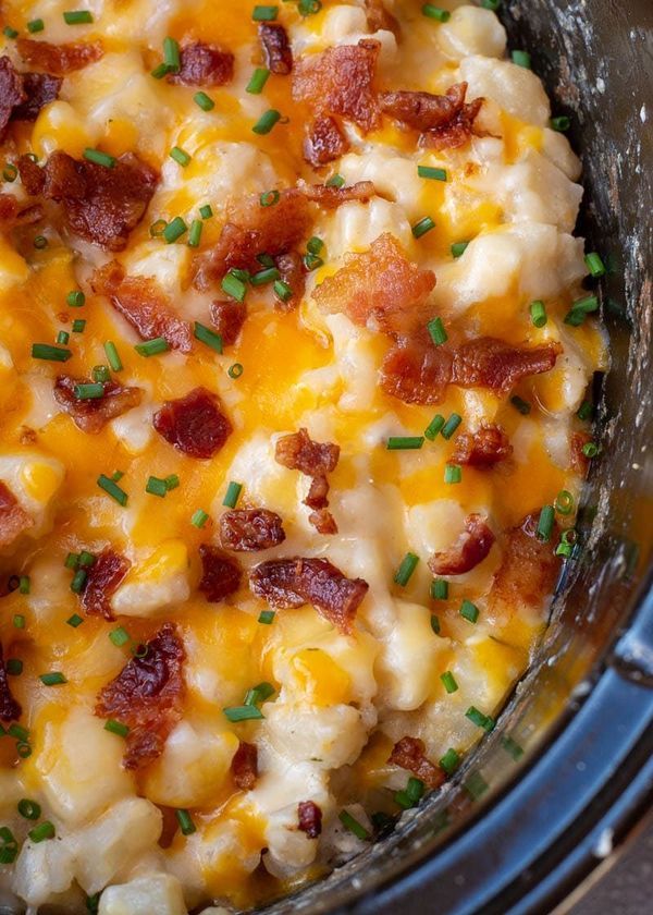 a crock pot filled with macaroni and cheese