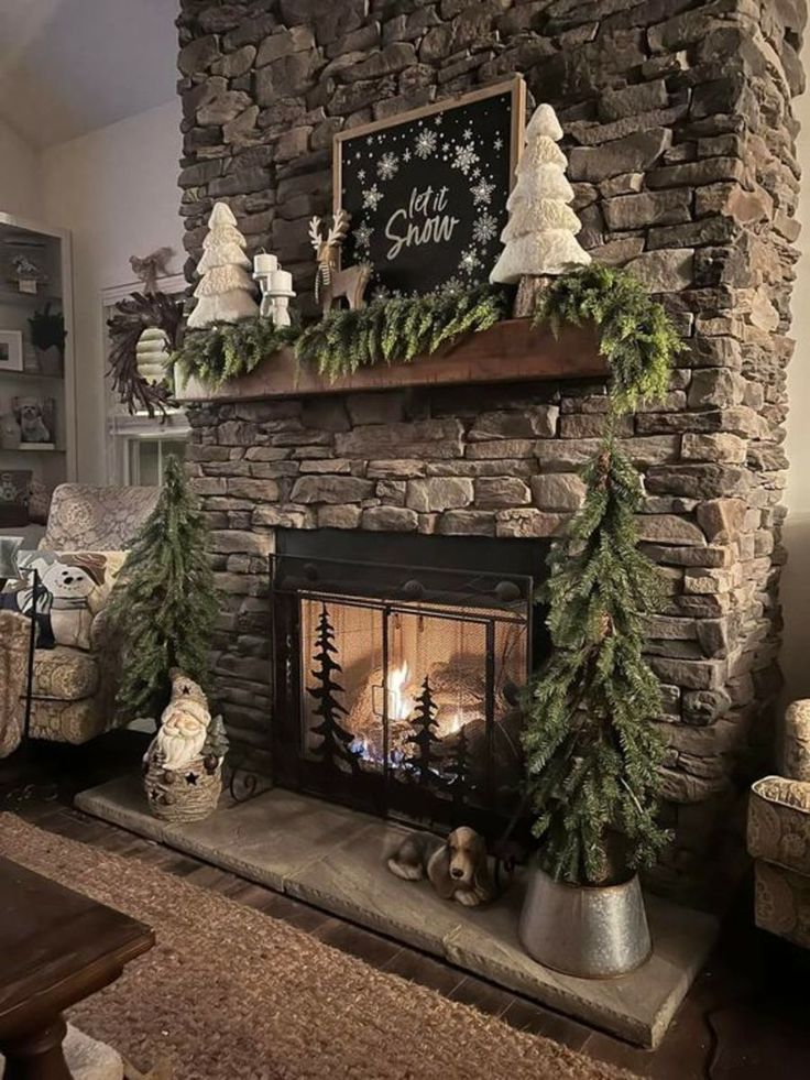 a living room with a fireplace decorated for christmas