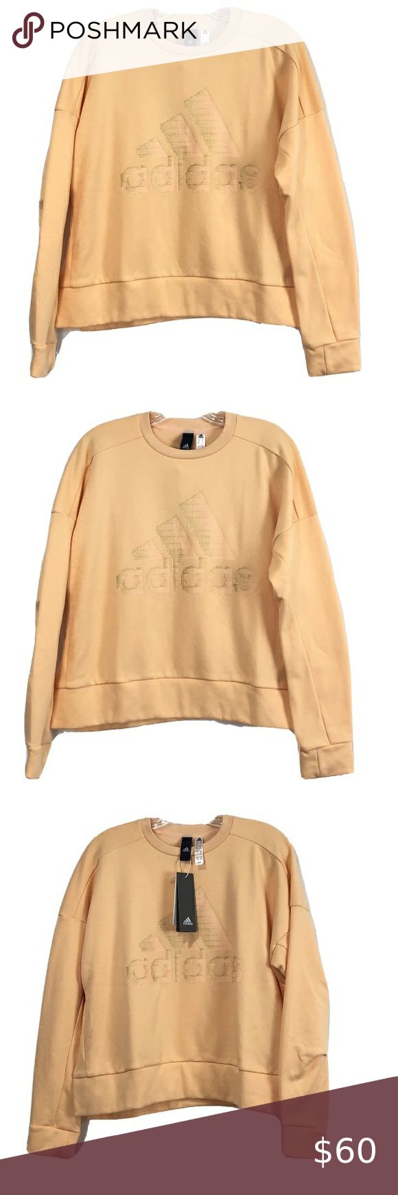 adidas ID Glam Sweater Pullover Orange Snap Sides adidas ID Glam Sweater Women's Pullover Orange Snap Sides New DZ8679 Approximate measurements: XS: 22.5" length x 20.5" pit to pit Small: 22.5" length x 21.5" pit to pit Medium: 23" length x 23" pit to pit Large: 25" length x 25" pit to pit XL: 26" length x 25.5" pit to pit 2XL: 26" length x 28" pit to pit Back Pleats Drapes at shoulders Bomber length Crew Neck Women's Pullover Sweater New with tags Ship Daily adidas Sweaters Crew & Scoop Necks Spring Sports Crew Neck Sweater, Long Sleeve Sports Sweater For Spring, Spring Sports Long Sleeve Sweater, Spring Long Sleeve Sports Sweater, Spring Adidas Sweatshirt For Sports, Adidas Long Sleeve Tops For Spring, Adidas Long Sleeve Spring Tops, Adidas Relaxed Fit Sweatshirt For Spring, Adidas Long Sleeve Athleisure Sweatshirt