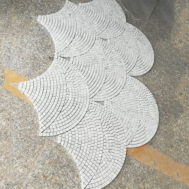 white marble mosaic tiles on the ground