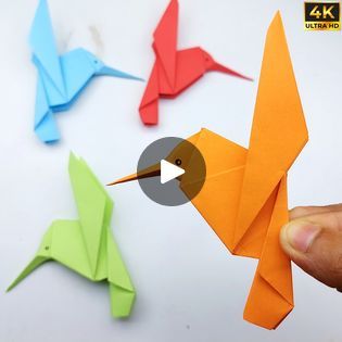 the origami bird is being used to make it look like an origami bird