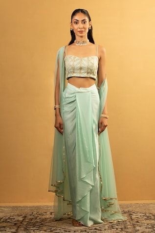 Ice blue blouse with gota work embroidery. Paired with draped dhoti skirt and cape. - Aza Fashions Fitted Pista Green Pre-draped Saree For Eid, Traditional Fitted Draped Sets, Fitted Festive Sets With Side Open Design, Fitted Draped Sets For Navratri, Fitted Pista Green Pre-draped Saree For Navratri, Traditional Fitted Set With Side Open Design, Traditional Fitted Sets With Side Open, Blue Blouse, Embroidered Blouse