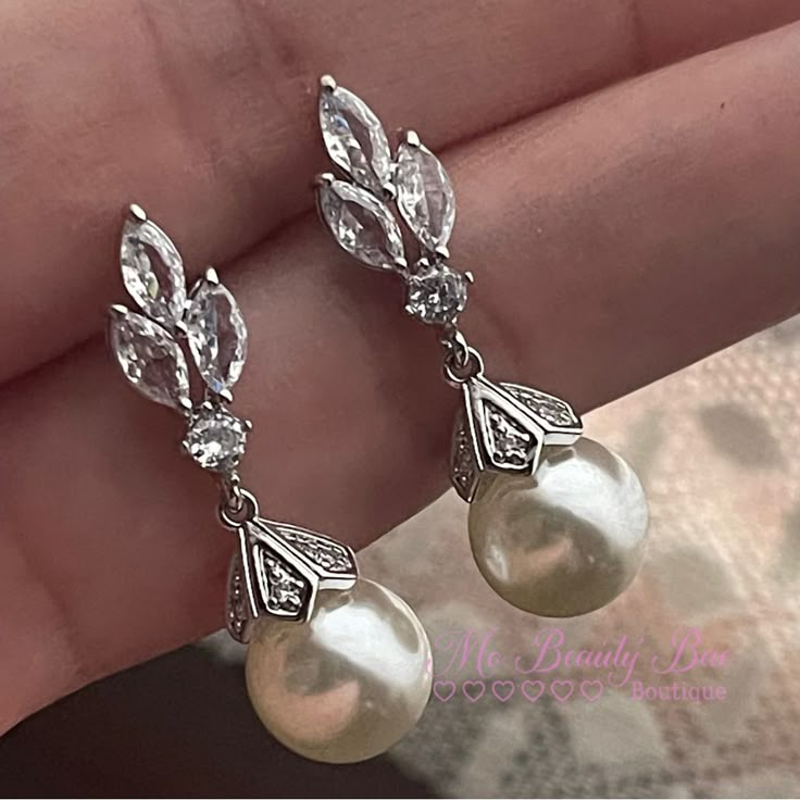 Crystal Pearl Drop Earrings Light Weight Dainty Cute Wedding Earrings. You Wont Even Notice You Have These On. A Classic Simple Take For An Elegant Look. Gold Plated Silver Earrings With Cz Crystals That Sparkle So Beautifully With A Stimulated Pearl. New To Poshmark? Sign Up Now With My Code: Mobeautybae To Save $10 On Your First Order. Relatable Searches: Wedding Earrings, Drop Earrings, Crystal Earrings, Silver Earrings, Pearl Earrings, Statement Earrings, Light Weight Wedding Earrings, Short Wedding Earrings Elegant, White Drop Earrings, Art Deco Pearl Earrings, Pearl And Silver Earrings, Chunky Pearl Earrings, Old Hollywood Jewelry, Vintage Earrings Victorian, Wedding Earrings Silver, Pearl Silver Earrings