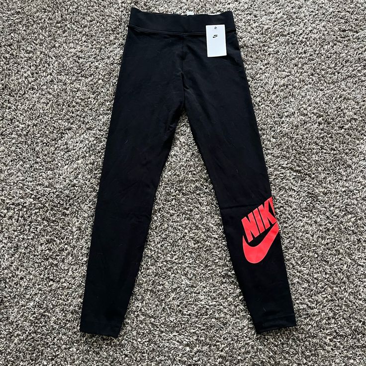 Brand New!! Black Leggings With Red Logo Women’s Small New With Tags! Nike Casual Tight Bottoms, Black Tight Pants For Streetwear, Tight Black Pants For Streetwear, Trendy Stretch Nike Bottoms, Nike Fitted Bottoms For Streetwear, Nike Stretch Casual Leggings, Nike Tight Athletic Activewear, Nike Red Pants For Streetwear, Tight Black Streetwear Pants