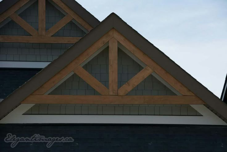 the roof of a house with wooden shingles