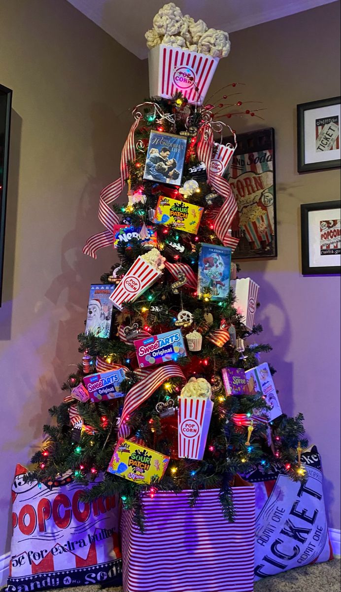 a christmas tree decorated with movies and candy