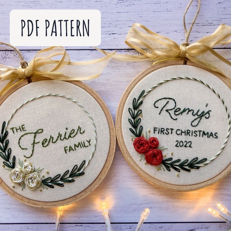 two embroidered christmas ornament with ribbon and bow on white wooden background, the text reads'the ferrets family first christmas 2012 '