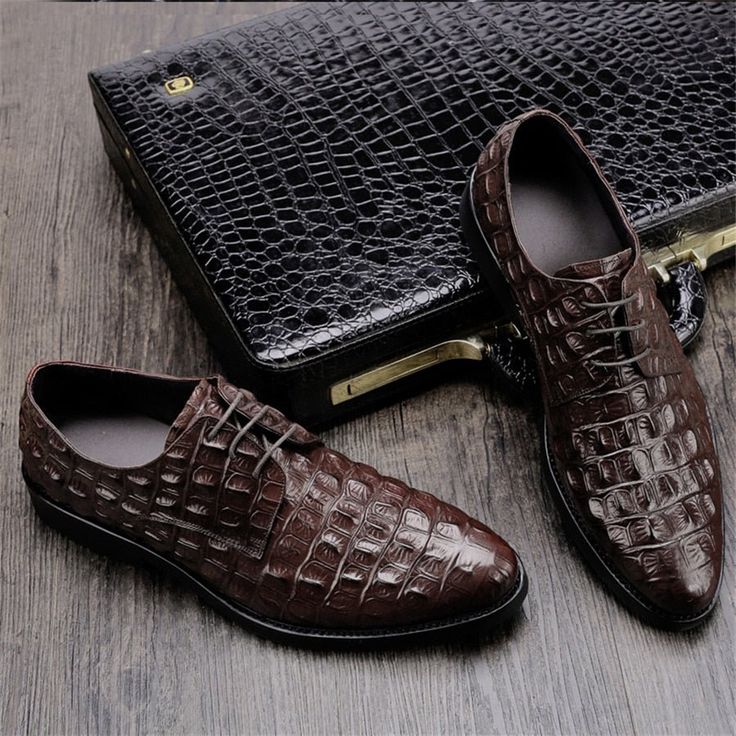 Introducing our Luxe Embossed Leather Oxford Brogues, the epitome of sophistication and comfort for the modern gentleman. With their timeless charm and refined pointed toe shape, these brogues effortlessly elevate any outfit, while the durable rubber outsole ensures stability on any surface. Customize your comfort with the lace-up closure and experience all-day support with the latex insole. Invest in these brogues and make a lasting impression wherever you go. Upgrade your shoe game and embrace the perfect fusion of style and functionality. Brown Leather Shoes With Crocodile Pattern And Pointed Toe, Brown Crocodile Pattern Pointed Toe Dress Shoes, Office Dress Shoes With Brown Crocodile Pattern, Brown Crocodile Pattern Dress Shoes For Office, Brown Pointed Toe Oxfords With Crocodile Pattern, Brown Crocodile Pattern Pointed Toe Oxfords, Elegant Crocodile Pattern Oxfords With Pointed Toe, Brown Crocodile Pattern Oxfords With Pointed Toe, Business Dress Shoes With Crocodile Pattern