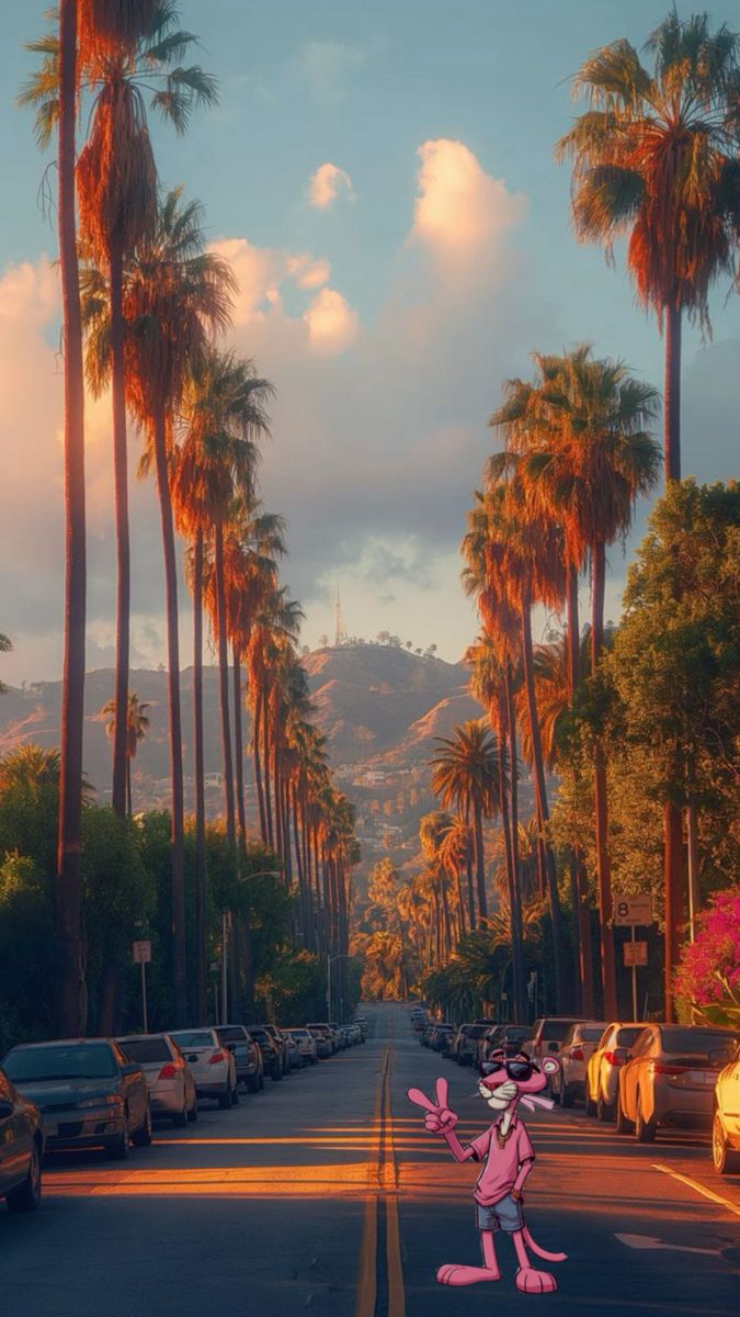 a street scene with cars and palm trees