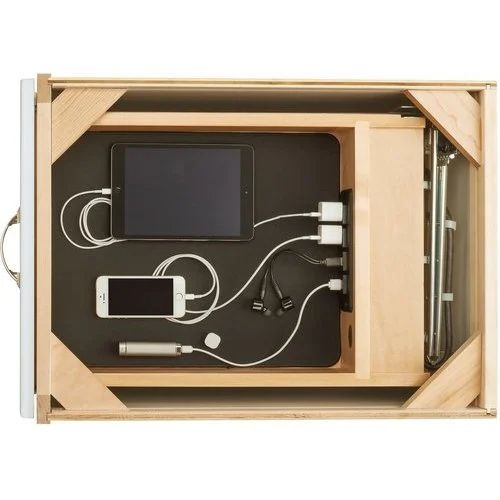 an open wooden box with electronic devices in it