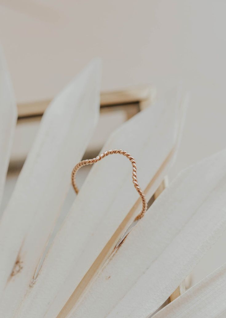 Originally designed to be paired with one of our Gemstone Rings, our Dune Ring stacks beautifully with any Stacking Bands and can hold it's own as a solo ring, too. Twisted wire is hand-shaped and made into a unique stacking ring. Available in 14kt Gold Fill + Sterling Silver. Handmade in Eau Claire, WI. Our jewelry is handmade so each piece will be unique and may vary slightly from what is pictured. Ring Stacks, Backdrops Necklace, Zodiac Rings, Ear Party, Hoop Charms, Stacking Bands, Twisted Wire, Jewelry Case, Stacking Ring