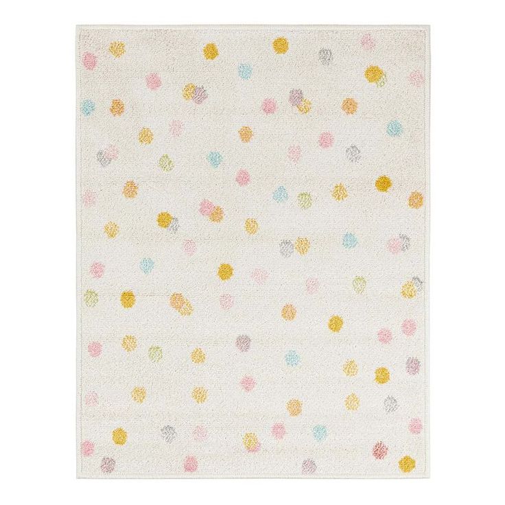 a white rug with multicolored polka dots on the front and back of it