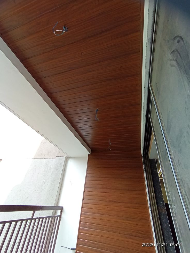 the ceiling is covered with wood planks