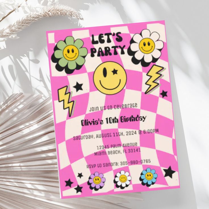 a pink and white checkered birthday party card with smiley face on it, surrounded by flowers