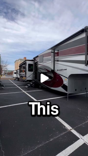 an rv parked in a parking lot with the words this on it