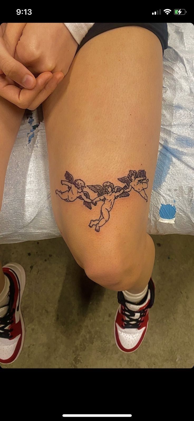 a woman's leg with a tattoo on it that has an image of a dog running