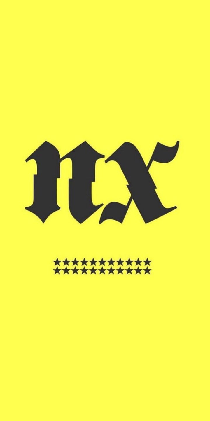 the letters are black and white on a yellow background, with five stars around it