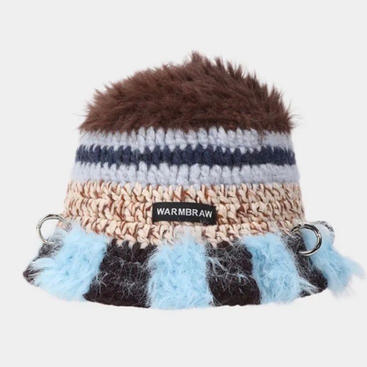 the hat is knitted with multicolored yarn and has a fur pom - pom