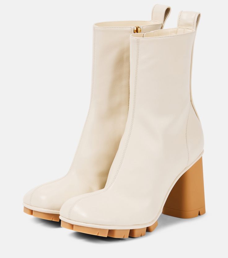 Shore leather ankle boots in white - Bottega Veneta | Mytheresa Square Toe Heeled Boots With Rubber Heel Cap, Luxury Square Toe Platform Boots, Beige Leather Mid-calf Boots High Ankle, Beige Leather Mid-calf Boots With Reinforced Heel, Leather Mid-calf Boots With Reinforced Heel In Beige, Modern Beige Calf Leather Boots, Cream Leather High Ankle Boots, High Ankle Cream Leather Boots, Beige Leather Platform Boots With Block Heel