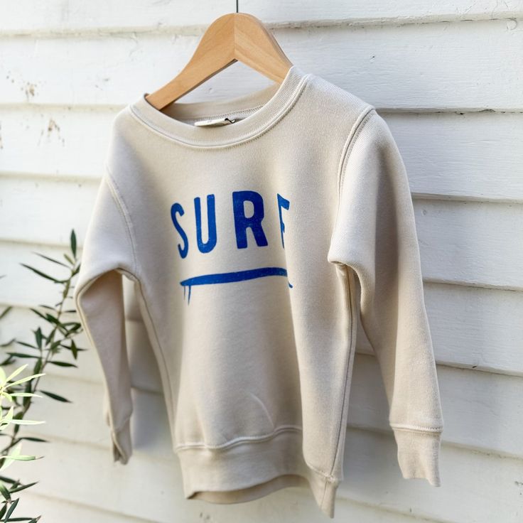 off white toddler sweatshirt with word SURF in blue on front Amazon Kdp, T Shirt Ideas, Water Based Ink, Shirt Ideas, Fleece Fabric, Side Hustle, Cute Things, Clothing Store, Fashion Forward