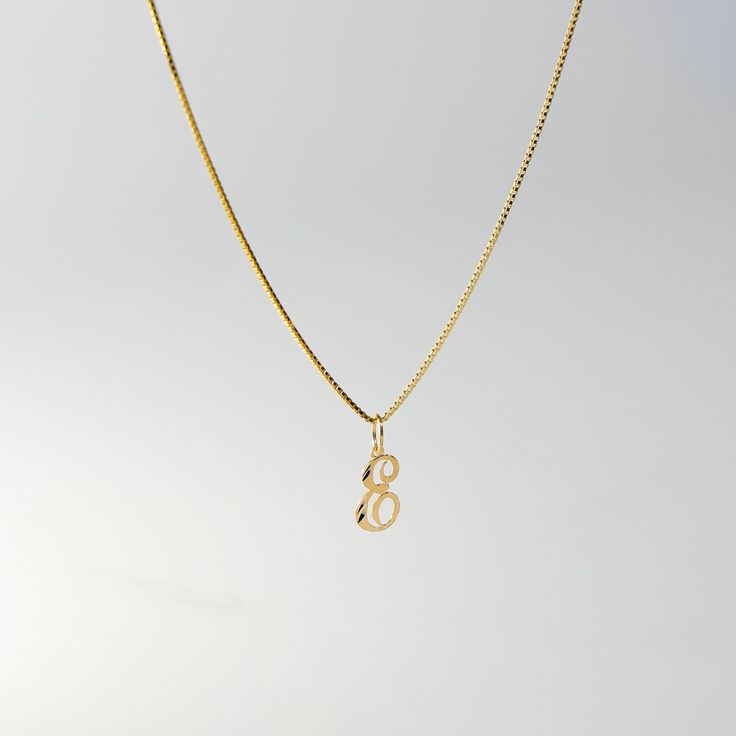 A timeless piece that will never go out of style. This 14K gold calligraphy pendant is the perfect and most stunning way of keeping a name close to your heart. We handmade each piece so you can assure you're getting a one-of-a-kind pendant that is not like any other. This 14K solid gold letter pendant is flawlessly crafted to look super chic and elegant around your neck. Pair it with a nice gold chain and wear it with almost all of your outfits. The piece is such a versatile lettering necklace. E Necklace Letter, Elegant Yellow Gold Snake Chain Charm Necklace, Yellow Gold Initial Pendant Charm Necklace With Box Chain, Elegant Initial Necklace With Box Chain As Gift, Yellow Gold Box Chain Necklace With Initial Pendant, Yellow Gold Necklace With Box Chain And Initial Pendant, Yellow Gold Initial Pendant Necklace With Box Chain, Elegant Yellow Gold Name Necklace With Box Chain, Gold Initial Necklace With Box Chain As Gift