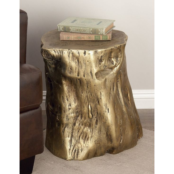 a gold stool with books on top of it