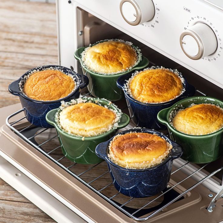 six baked pies are sitting in front of an oven