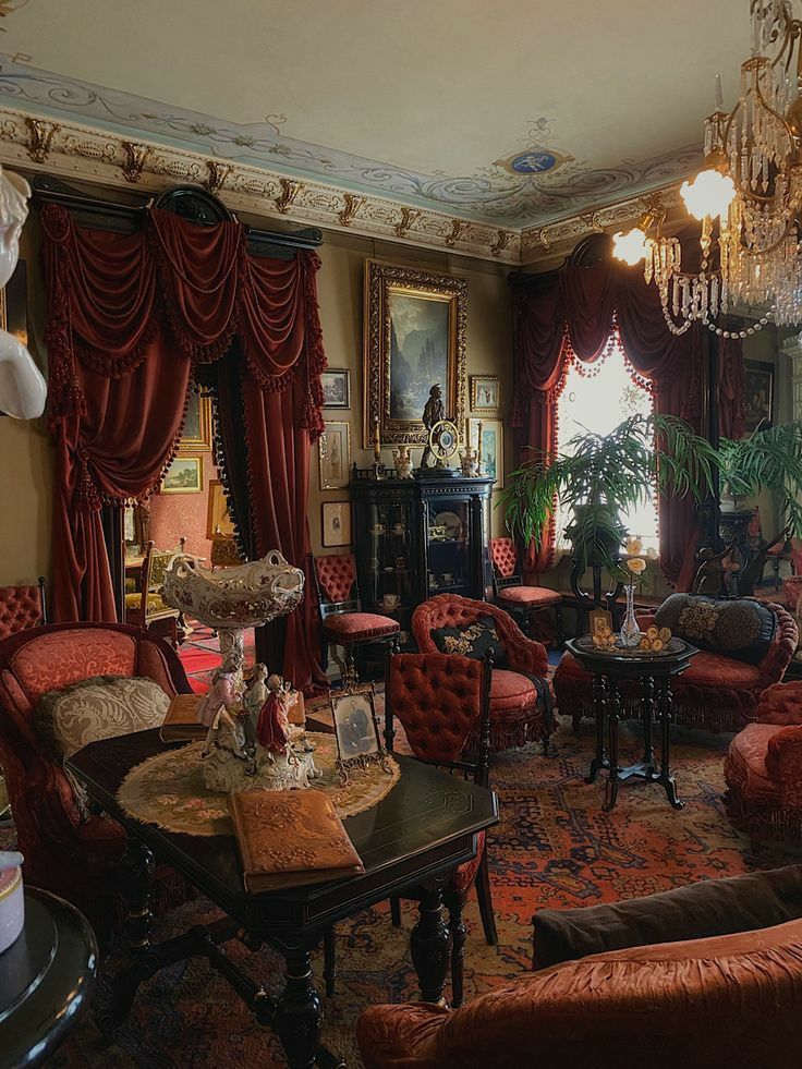 a living room filled with lots of red furniture