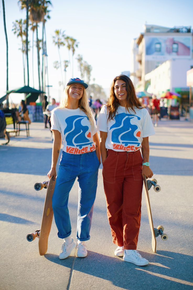 Our hometown - Venice, CA! Flowy skater design mixed and bright colors embodies Venice essence! The tee is the softest, most cozy shirt -- with a vintage wash, it looks like you grabbed it straight from your cool aunts 70s wardrobe. Our limited edition Junk Food Clothing Tee Shirt Collab is here! Now your favorite soft tees come in your favorite GRLSWIRL style. Casual Relaxed Fit T-shirt With Retro Print, Retro Cotton T-shirt For Surfing, Trendy Cotton T-shirt For Skateboarding, Vintage Screen Print Tops For Skateboarding, Casual Graphic Print Tops For Skateboarding, Groovy Cotton Tops For Streetwear, Trendy Graphic Print Tops For Skateboarding, Trendy Crew Neck T-shirt For Skateboarding, Casual Cotton Tops With Retro Print