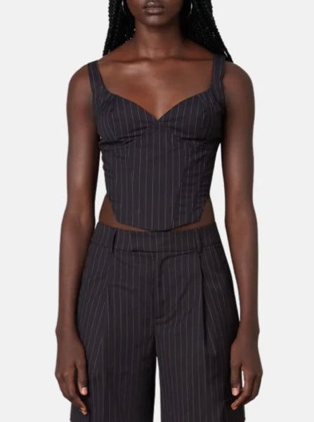 A bold basic! Be bold in the Noa Corset top in Black. This corset features light boning and a white pinstripe pattern, offering structure and sophistication. This top is the perfect go-to whether you are going out to a bar, or layering for work! Pair it with the matching trousers for a completed look. 65% Polyester 35% Rayon Contemporary Loft, Cropped Corset, Corset Black, Corset Outfit, Pinstripe Pattern, Linen Fashion, Cute Boutiques, Night Out Outfit, Closet Fashion