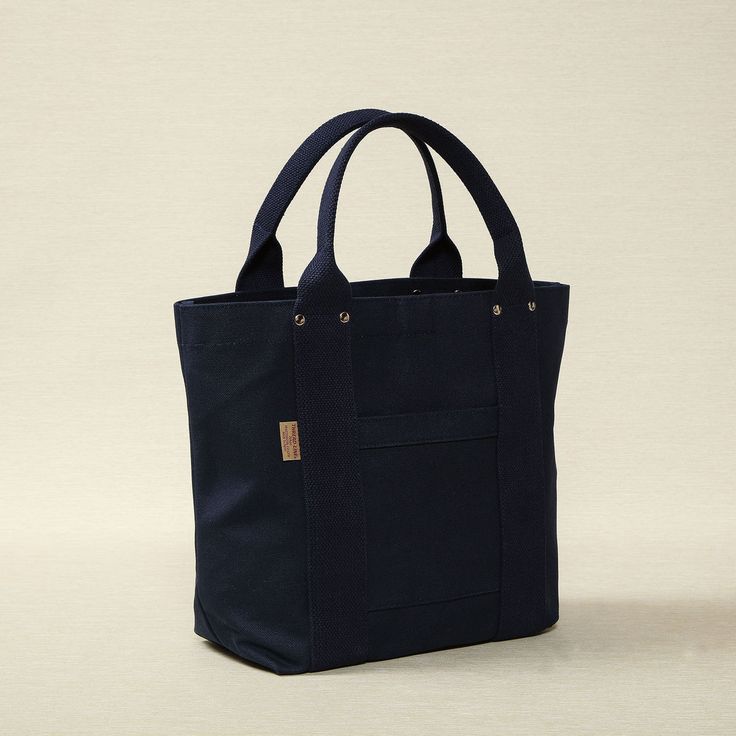 Heavy weight canvas medium tote in navy 16.5" x 5.5" x 12.6" Made in Japan, bag, tote bag, canvas tote bag, threadline bag, tote, cotton bag, cotton tote bag On-the-go Canvas Bag With Reinforced Handles, Cotton Canvas Bag With Top Carry Handle, Daily Use Cotton Canvas Bag With Top Carry Handle, Travel Canvas Bag With Reinforced Handles, Canvas Tote Bag With Top Carry Handle, Everyday Blue Canvas Bag With Reinforced Handles, Cotton Shoulder Bag With Rolled Handles For Daily Use, Cotton Shoulder Bag With Rolled Handles, Canvas Bag With Rolled Handles For Everyday Use