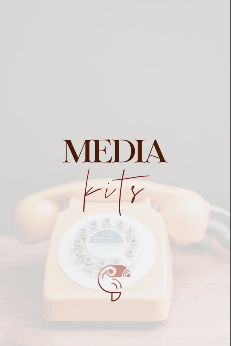 an old fashioned phone sitting on top of a wooden table with the words media kits above it