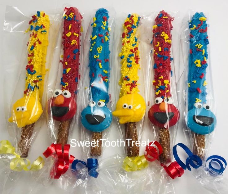 five sesame street party time favors in plastic bags