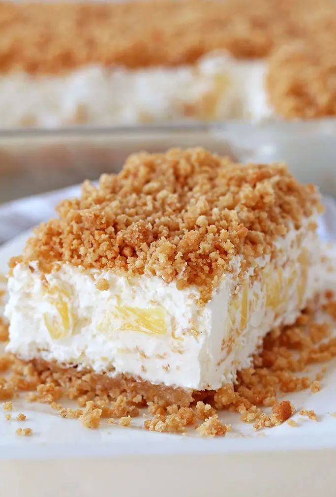 a piece of cake sitting on top of a white plate with crumbs around it