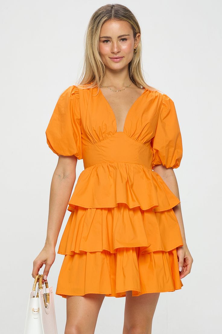 Flirty and fun, this ruffle mini dress comes in lightweight cotton poplin. With puff sleeves and a feminine bustline, it's a sweet must-have to add to your summer dress rotation. Product Details Material: 100% Cotton; Lining: 94% Polyester, 6% Spandex. Fit: True to size. Body length: 35" from shoulder to hem (size Small). Fabric: Soft structured cotton, lightweight. No stretch.Features: Puff sleeves with elastic arm cuffs, fitted waist, ruffle skirt, back zipper. Model: 5'8.5" / Wearing a size S Orange Ruffle Dress, Argyle Sweater Vest, Leather Mini Dress, Linen Suit, Wide Leg Linen Pants, Argyle Sweater, Ruffle Mini Dress, Satin Maxi Dress, Shoulder Crop Top