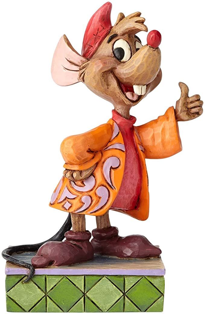 a figurine of a mouse wearing an orange outfit