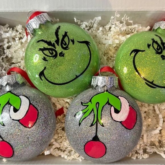 three grin face ornaments in a box