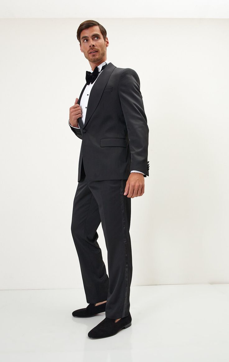 If you find your evening event calendar filling up fast, it might be time to boost your black tie attire with a luxurious dinner jacket, like our classic black style. Made from a textured lustrous fabric with tactile irregularities on the surface, it's tailored with elegant shawl lapels and fastens with covered buttons for a streamlined finish. The full lining reinforces the fine cloth and means it'll layer smoothly over your shirt. Made in Turkey Style #19033 Classic Shawl Collar Tuxedo For Black-tie Events, Black Notch Lapel Tuxedo With Button Closure, Silk Long Sleeve Single-breasted Tuxedo, Fitted Black Tuxedo With Double-breasted Button, Black Tie Tuxedo Style Single-breasted Outerwear, Black Tie Attire, Elegant Shawl, Dinner Jacket, Los Angeles California