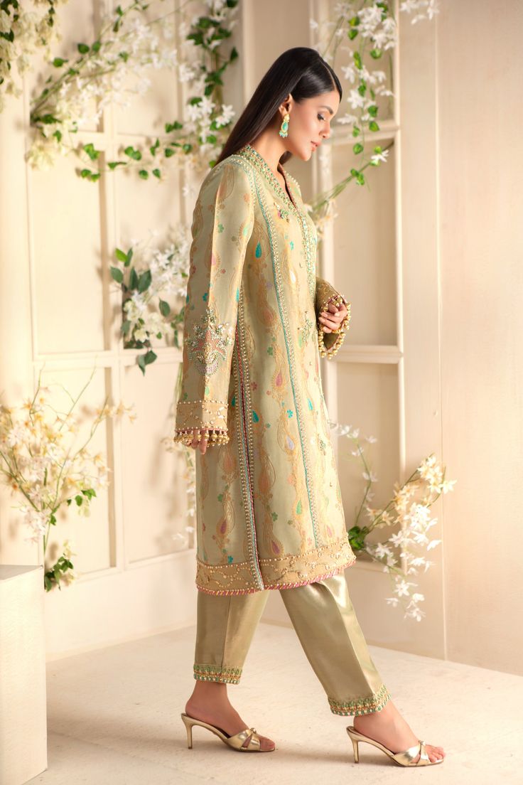 Gorgeous jacquard maysuri column shirt delicately embroidered with gota, tila, dabka, sequins, pearls & kundan work. Stunning maysuri dupatta with gota florals and sequins scattered motifs all over, & heavily, finished with opal hued atlas silk border and gota details adds a fun & festive element, handmade tassels on sleeves & dupatta for a perfect traditional feel.This stunning kurta is paired with tissue shalwar with hand embroidery to complete the look of this outfit, perfect for all celebrat Kundan Work, Designer Outfit, Pistachio Green, Pakistani Designers, Hand Embroidery, Custom Sizing, Tassels, Opal, Take That