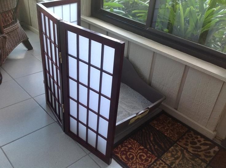 a room divider sitting on top of a tiled floor next to a chair and window