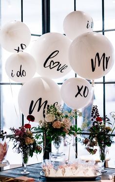 balloons with the words i do and mr and mrs written on them in black ink