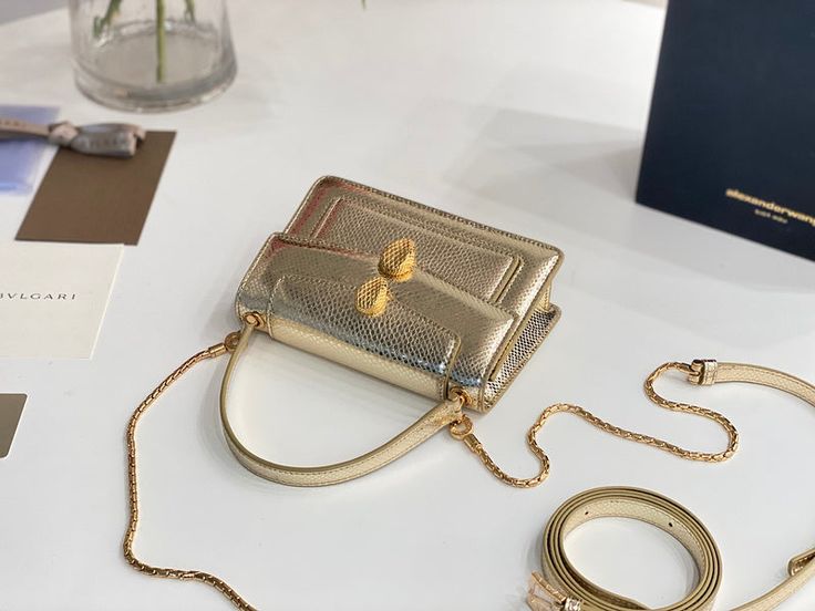 Size: 19cm*13cm*6.5cm It comes with Dust box, Care manual, Tag, and Paper bag. High-end Pouch Shoulder Bag As Gift, High-end Gold Pouch Shoulder Bag, High-end Gold Shoulder Bag As Gift, High-end Gold Flap Shoulder Bag, High-end Gold Box Bag For Daily Use, High-end Gold Crossbody Flap Bag, Designer Top Handle Shoulder Bag, High-end Gold Bag As Gift, High-end Clutch Shoulder Bag As Gift